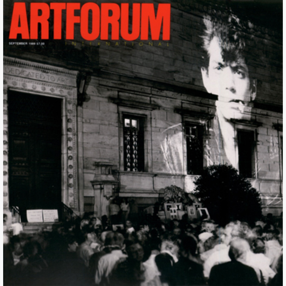 The cover of Artforum's September 1989 issue showing a self portrait of Robert Mapplethorpe projected onto the Corcoran Gallery's facade