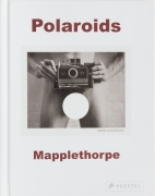 Light gallery invitation, Polaroid image of Mapplethorpe holding a Land Camera over his genitals.