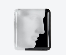 Square tray with a close up photograph of a sculpture of Ermes against a black background.