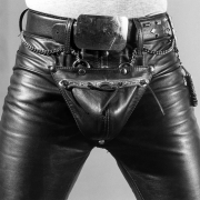 Man wearing leather pants and a belt.