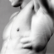 Male nude's chest and armpit.