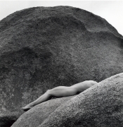 Lisa Lyon lying on rocks nude.