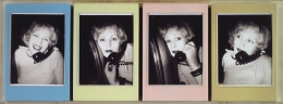 Four Polaroids of Candy Darling on the phone with their white edges painted light blue, yellow, pink, and tan and contained in an acrylic box.