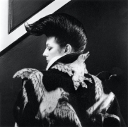 Photograph of Diane Benson's profile taken from behind, wearing a jacket with seagulls.