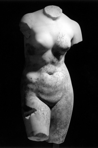 Sculpture of a woman without head, arms, and legs.