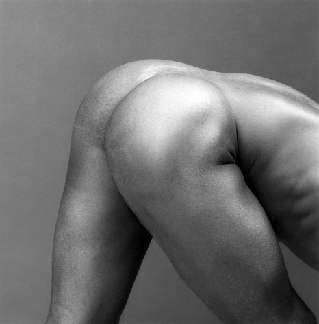 Portrait of a nude from behind--of butt, torso, and legs.