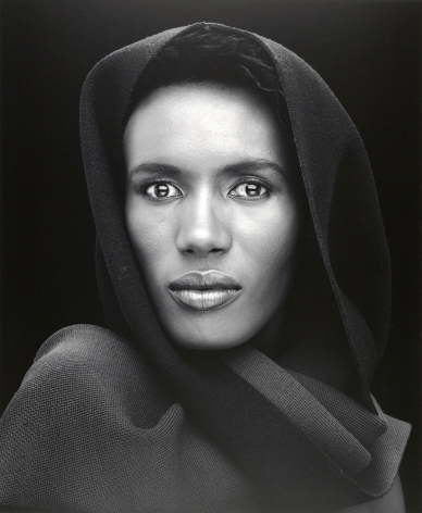 Portrait of Grace Jones looking directly at camera.