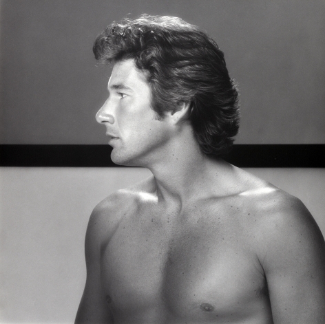 Photo of Richard Gere topless looking to the right.