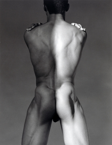 Male nude from behind in partial shadow.