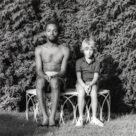 Jack Walls and a young boy sitting side by side.
