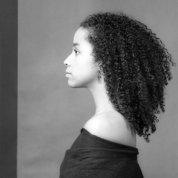 Portrait of black woman in profile.