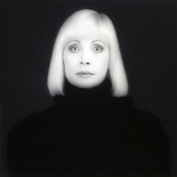 Portrait of Doris Saatchi wearing a black turtleneck, looking straight into camera.