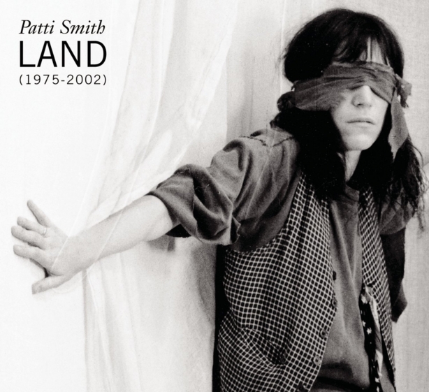 Album Cover Patti Smith Land (1975-2002), Patti blind-folded with arm outstretched towards camera.