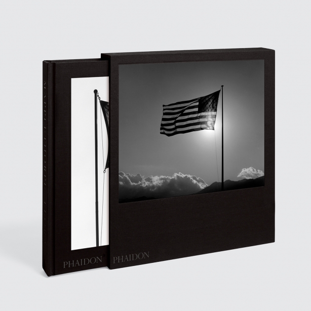 Slipcase Bookcover showing a backwards American flag blowing in the wind
